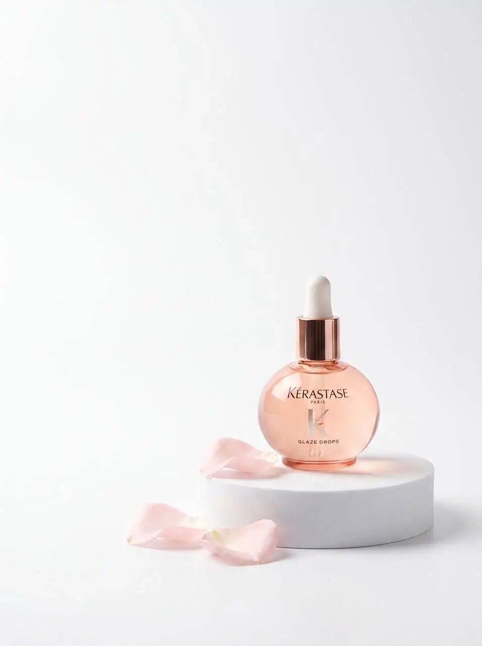 a bottle of aromatic oil stands on a stand small size