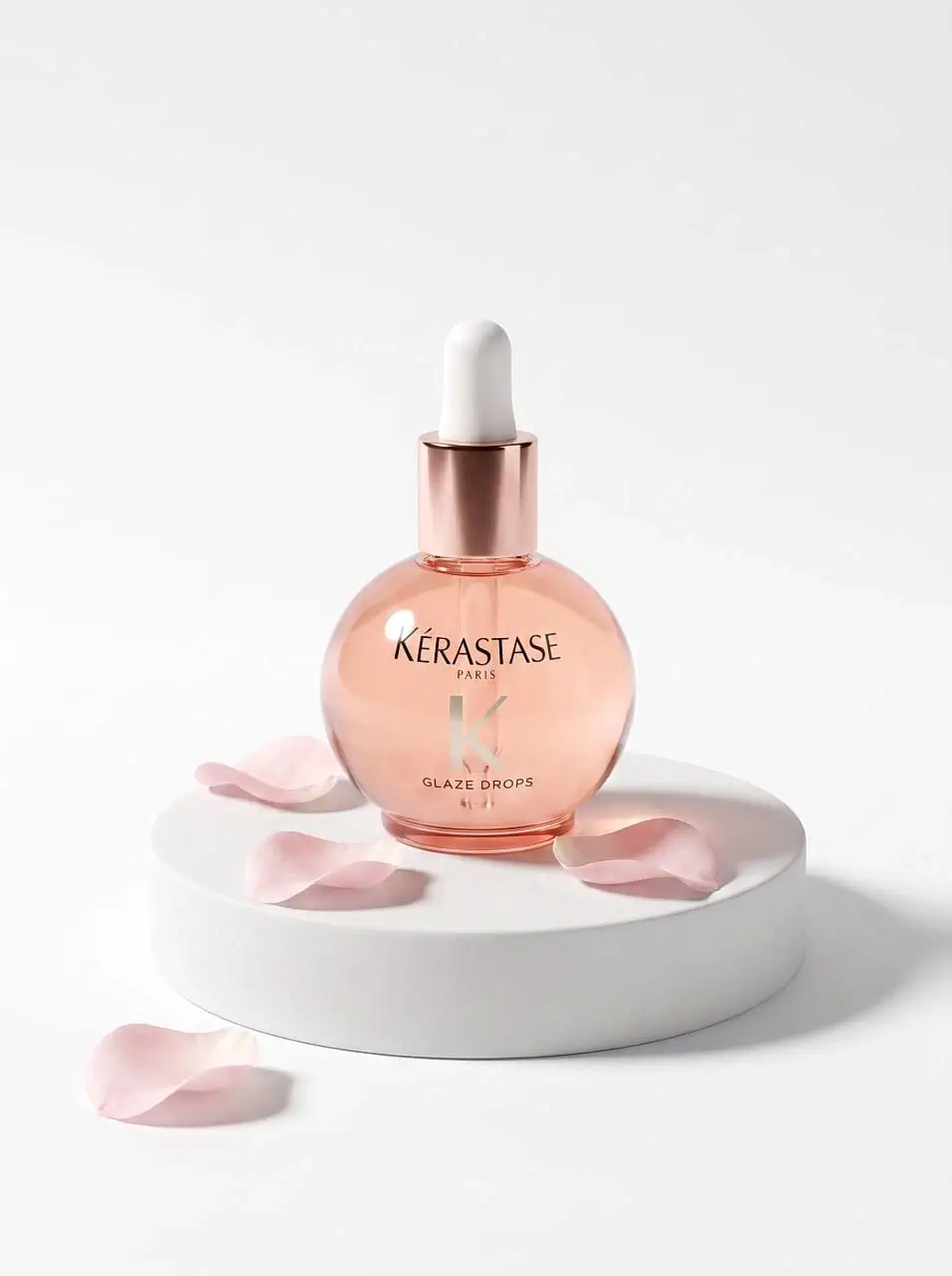 a bottle of aromatic oil stands on a stand zoom size